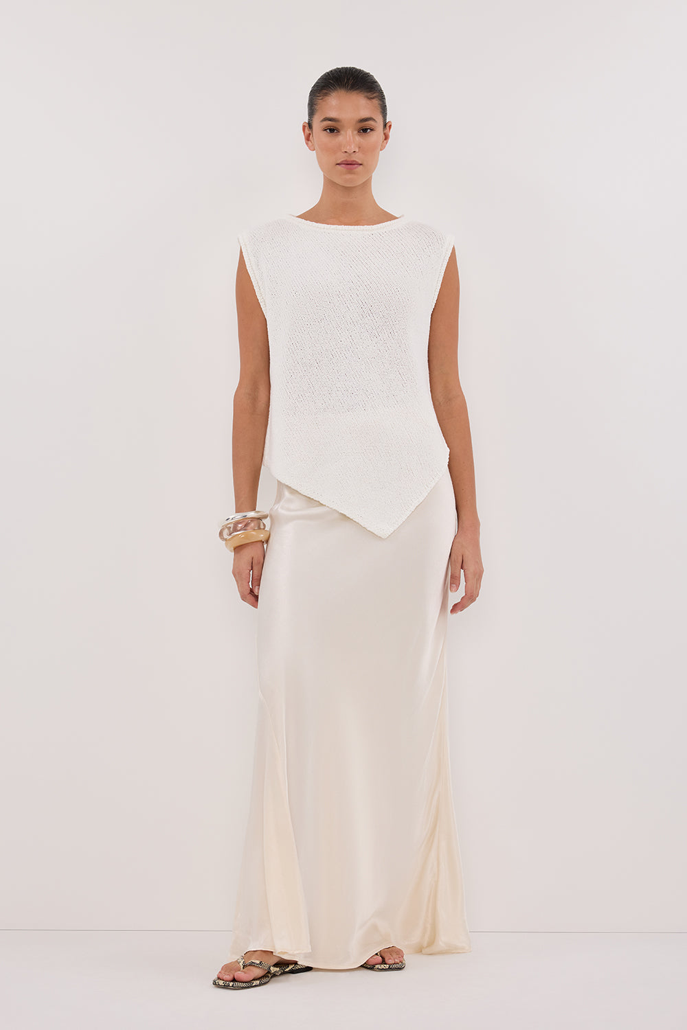 Althea Off White Asymmetrical Sleeveless Knit Top