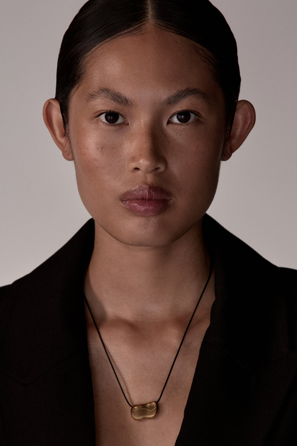 Heaven Mayhem Gold Pebble Necklace with Black Leather Cord
