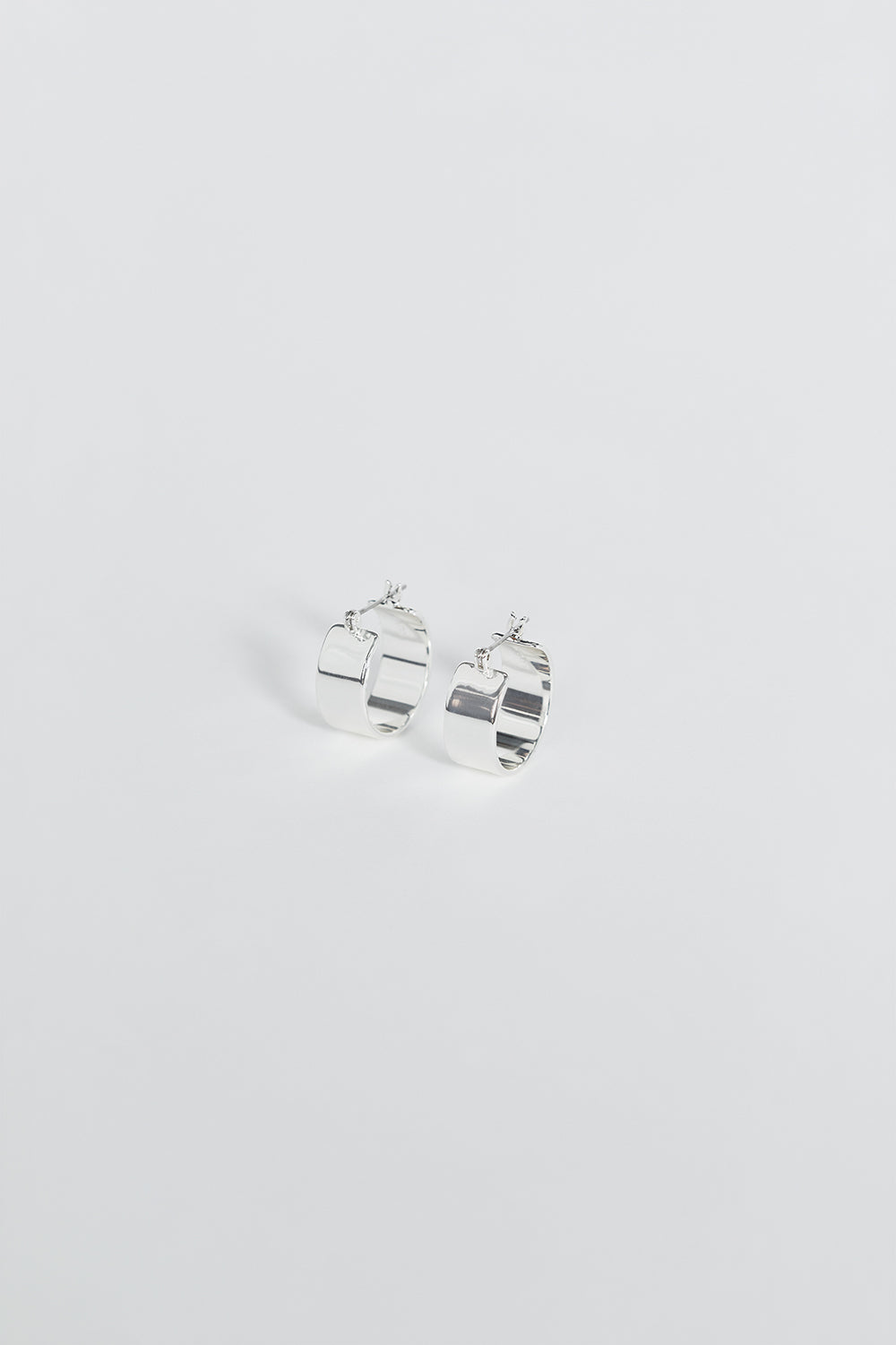 LUV AJ Positano Silver Hoop Earrings - Hollow Clip Back